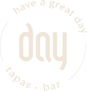 Circular beige logo with the arched slogan "have a great day" around the edge and a stylized central wordmark reading "day" for a tapas bar.